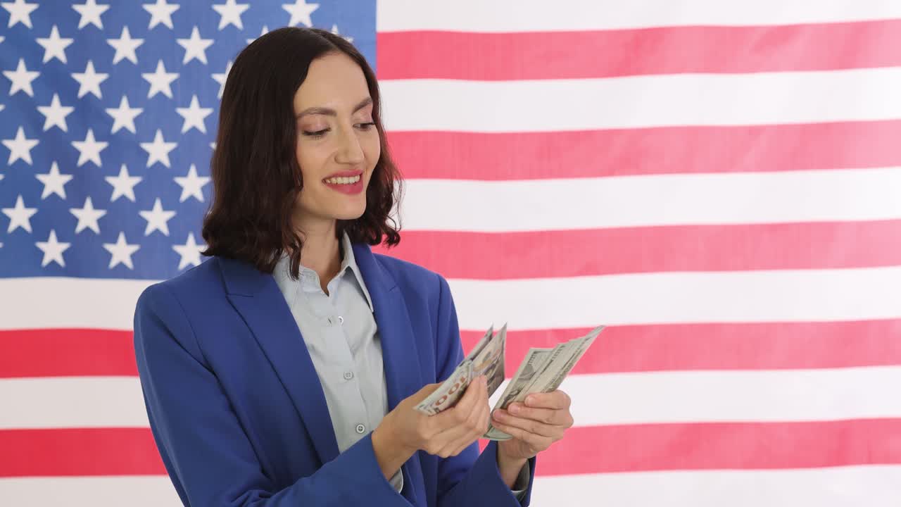 Woman Counting US Dollars in Front of American Flag