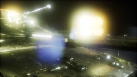 tanque en la oscuridad con luces brillantes