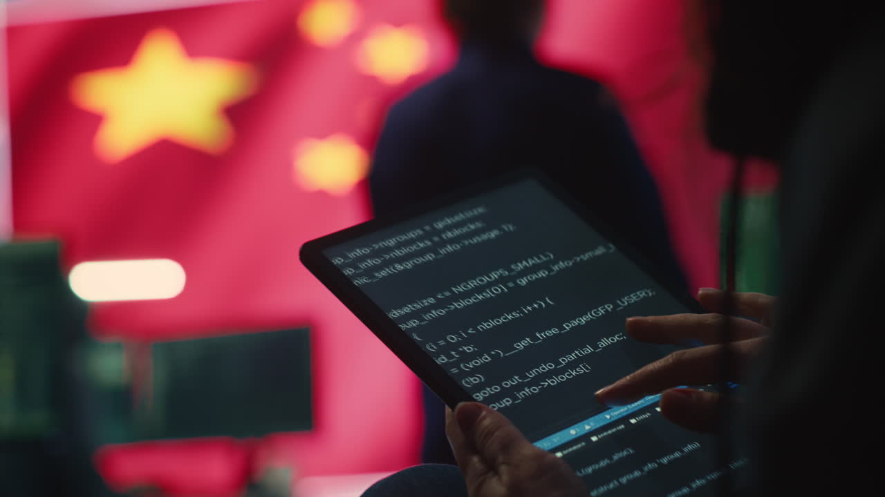 Chinese hacker uses a tablet in governmental cyber operations office