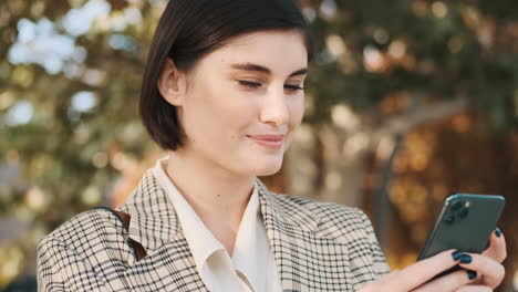 young stylish lady chatting outdoor.