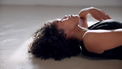 Dancing,-woman-and-lying-on-floor-for-performance