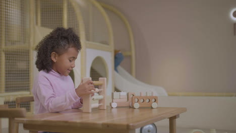 little girl counting in playroom