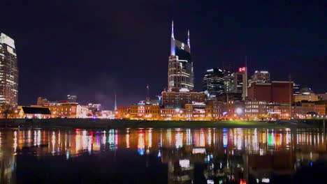downtown nashville, tennessee city skyline across the cumberland river, reflection light in the river water