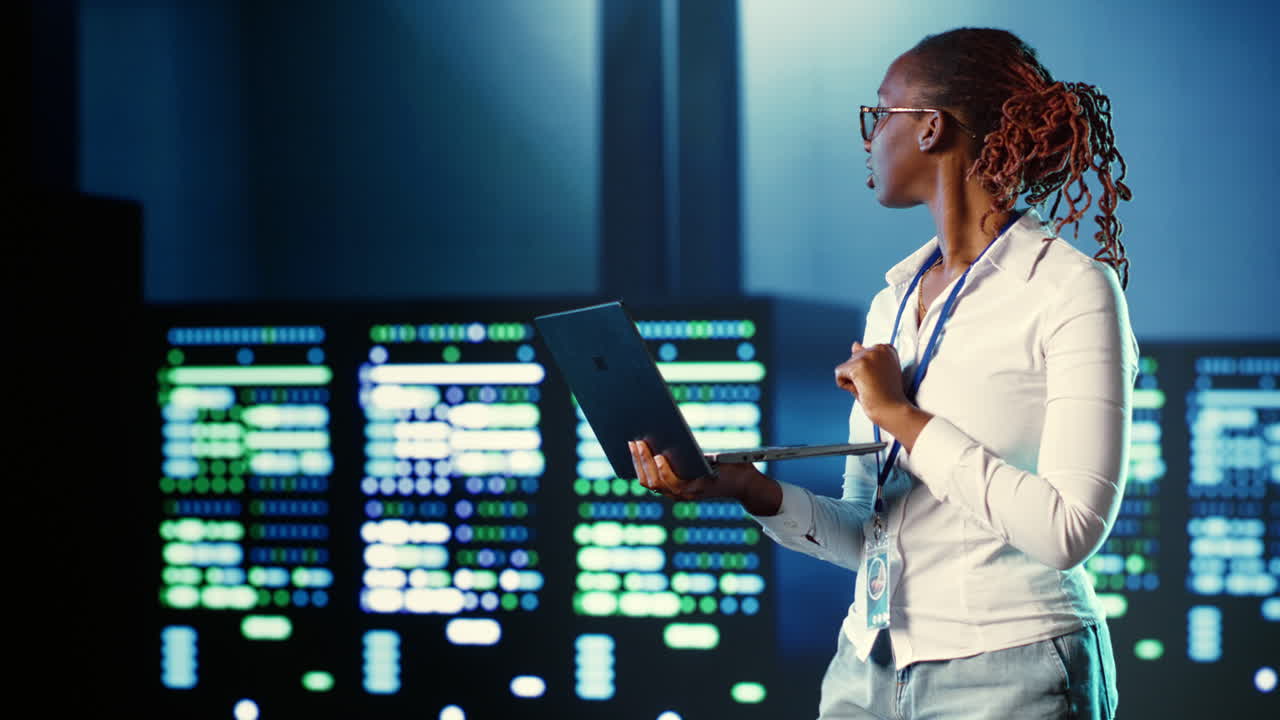 Computer scientist coding in data center