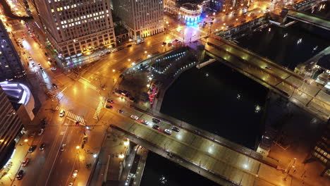 aerial view of the chicago loop at night. shot along the chicago river.