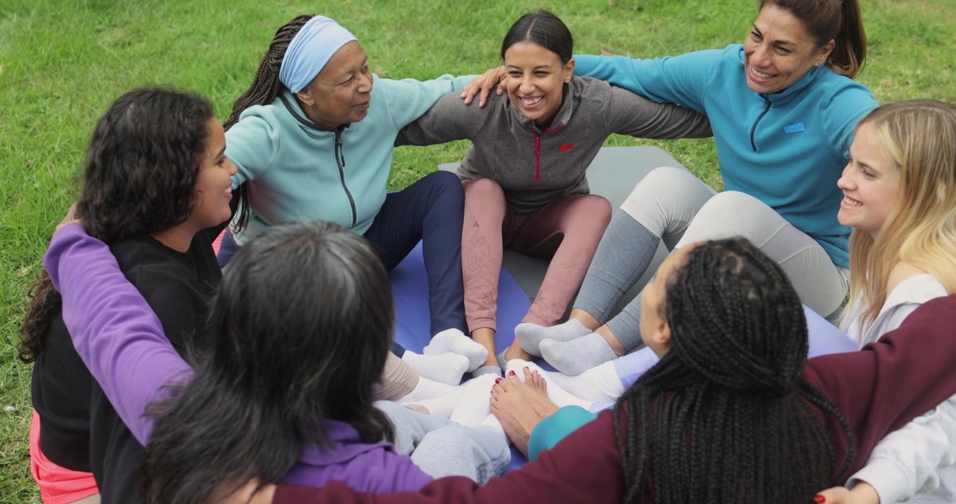 Diverse Group of Women Sitting in a Circle Outdoors