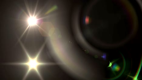 spot of light and lens flare against black background