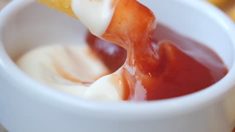 french fries with ketchup and mayonnaise