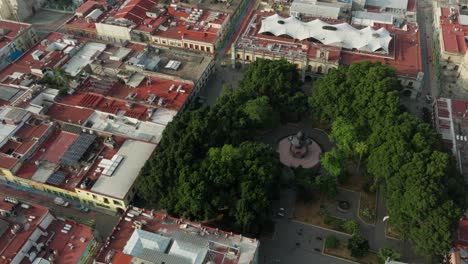 drone: orbit shot of the main alameda in oaxaca at the early morning