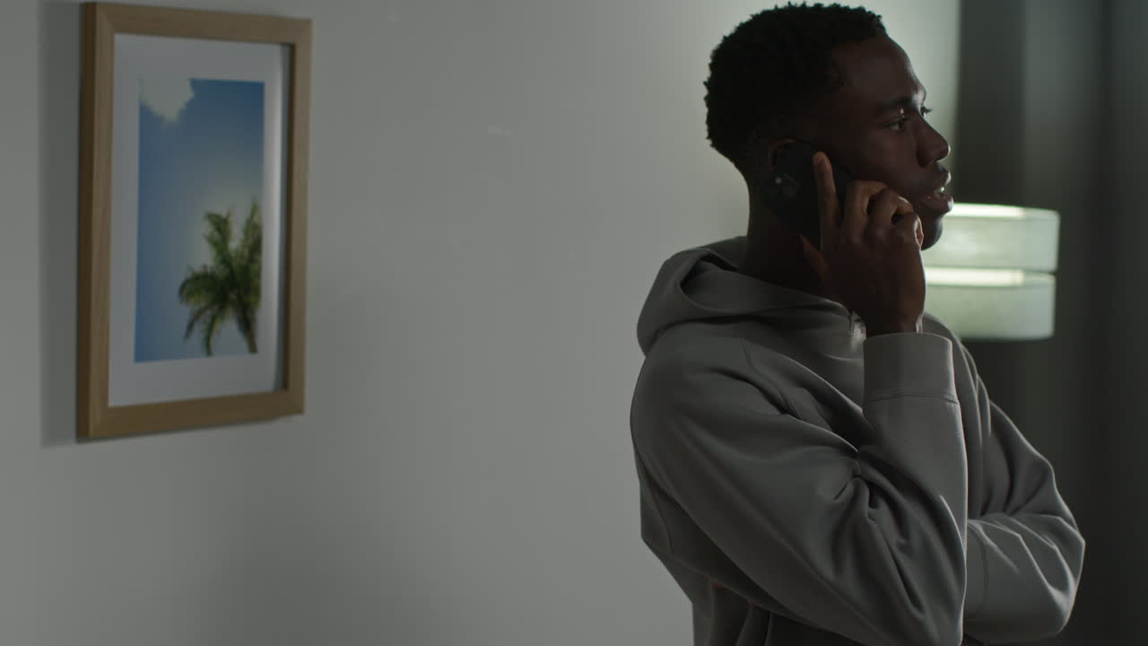 Close Up Of Young Man At Home Talking On Mobile Phone Reacting And Looking Upset After Getting Bad News 3