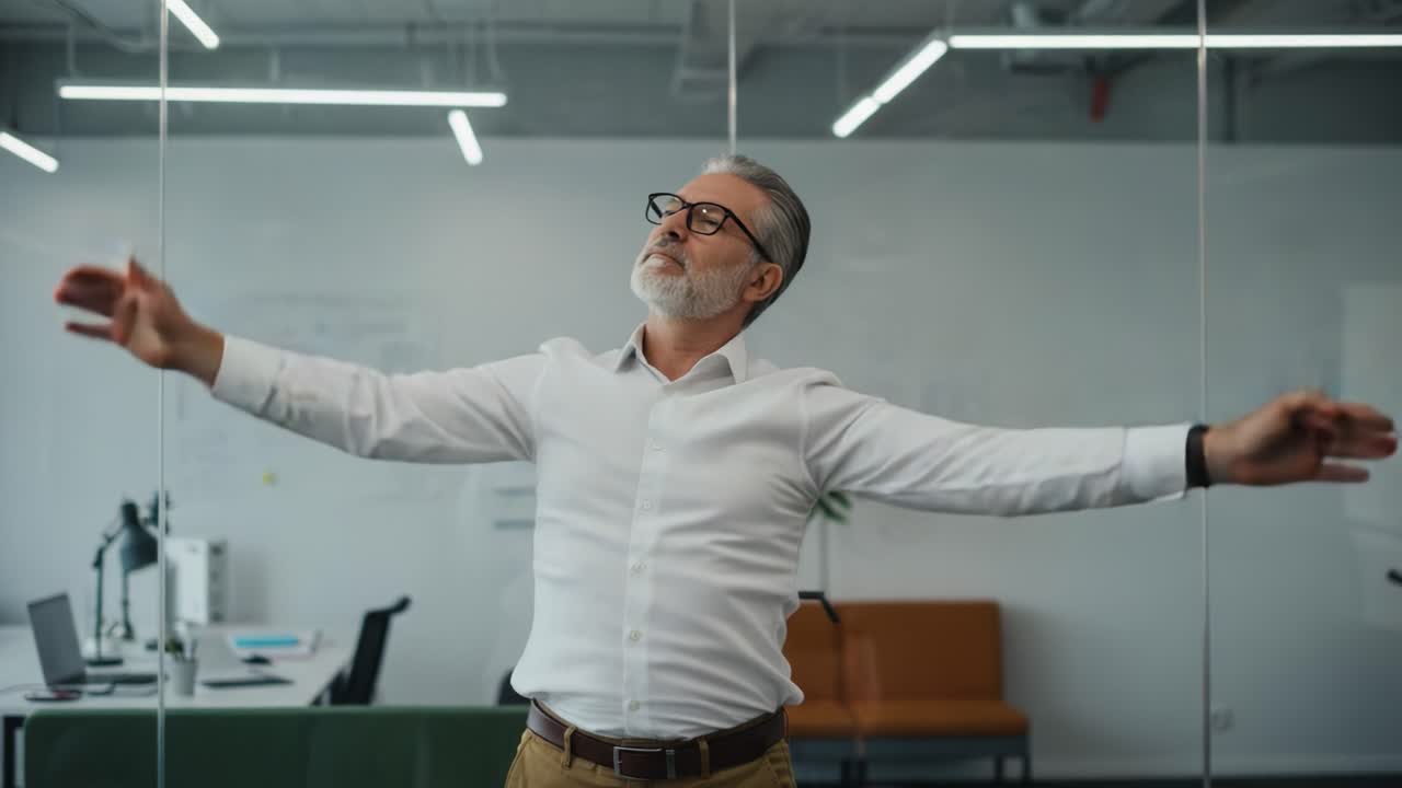 A Middle-Aged Man Engages in Stretching Exercises in a Modern Office Environment, Promoting Wellness and Mindfulness in the Workplace