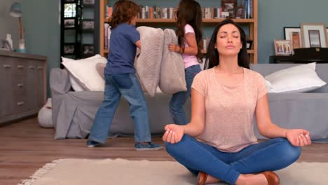 mother trying to relax while children playing