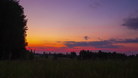 timelapse view of a sunrise over a beautiful countryside as clouds roll in demonstrating a magnificent color display as the sun rises