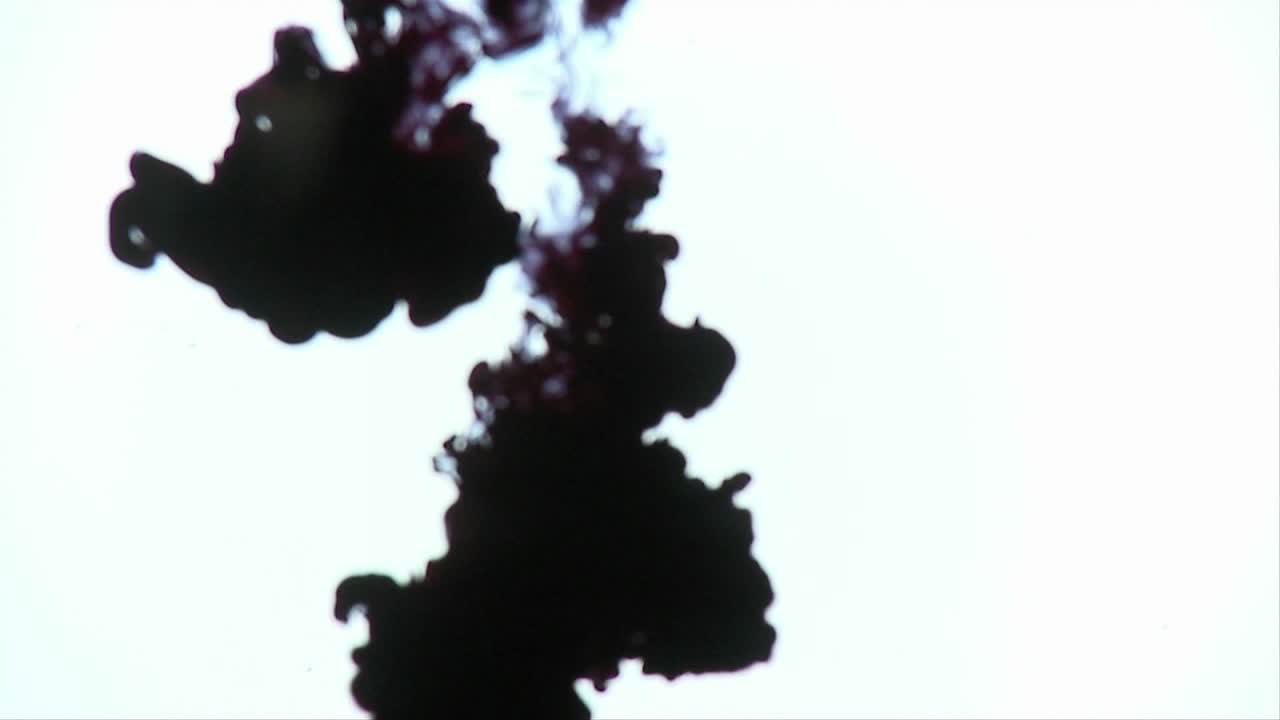 Ink is dropped into water creating interesting designs