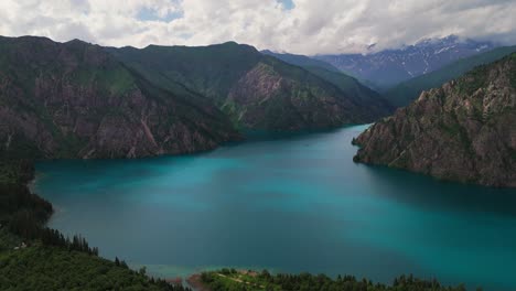 aerial sary chelek lake in kyrgyzstan drone fly scenic landscape with mountains in natural reserve