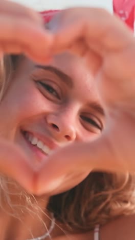joyful smiles and heart shapes capture love in a sunny summer moment
