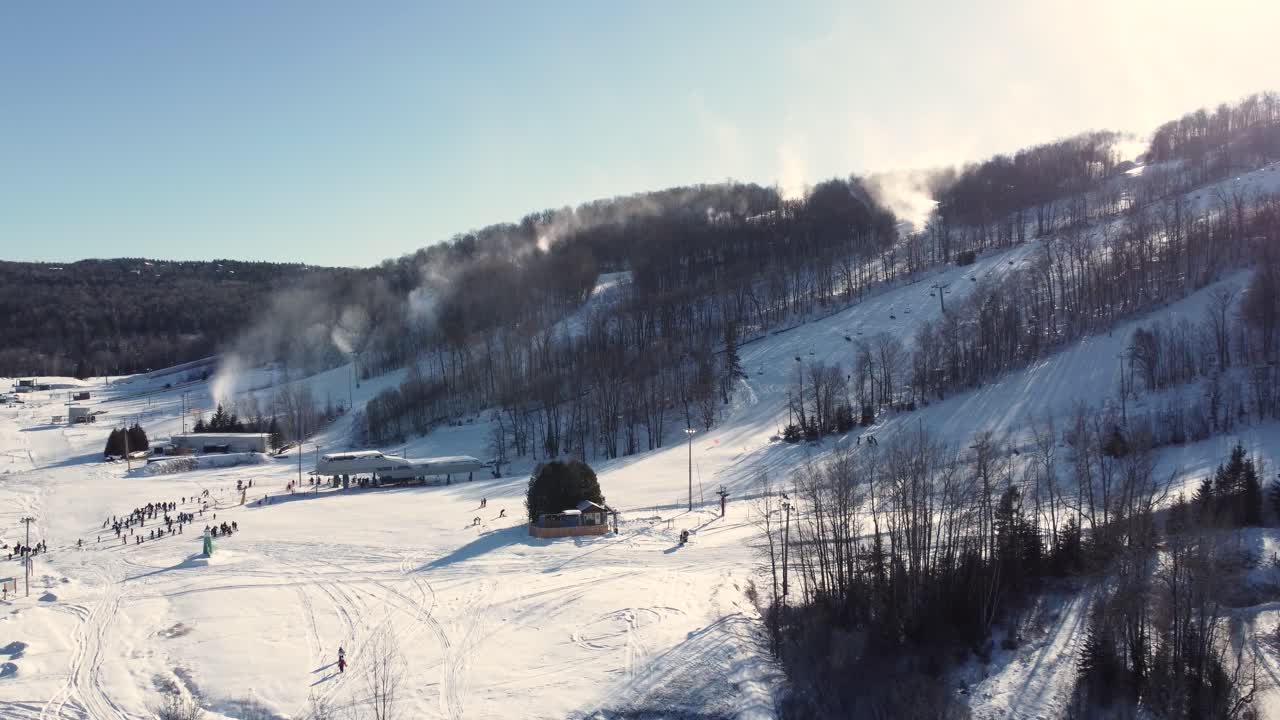 Tourists On Winter Day At Ski Resort In Saint-Sauveur, Quebec, Canada. wide shot