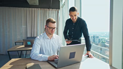 businessmen collaborating on a project in a modern office