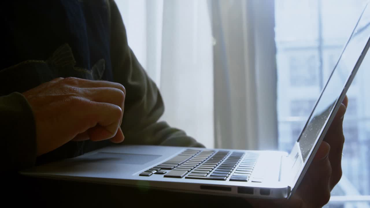 Craftsman using laptop in workshop 4k