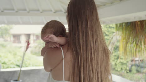 woman comforting crying baby