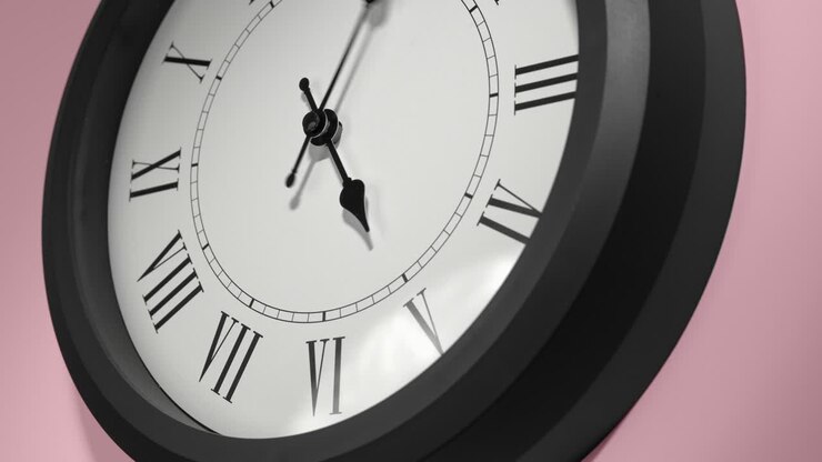 Latin Clock Face on Rosy Rose Pink Wall in Time Lapse