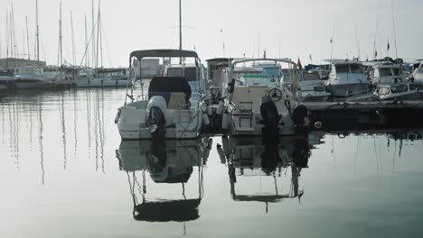 harbor scene, boats moored in spanish town port, static shot