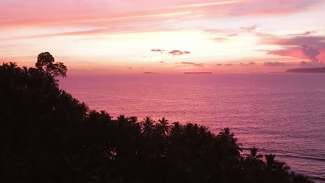 sunset at a remote surfing spot in the mentawai islands, drone shot