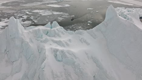 drone over sea and ice of ilulissat icefjord