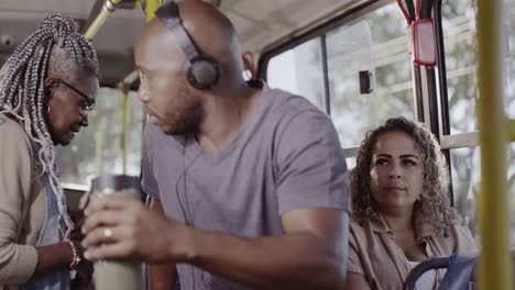 diverse group of people commuting on a public bus