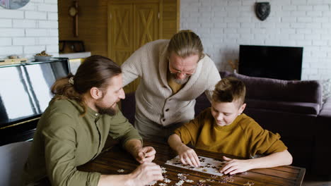 caucasian men and boy in the living room