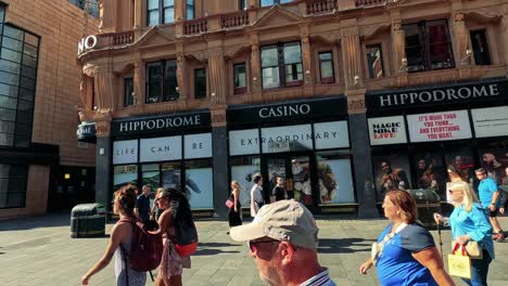 crowds walking past shops and casino