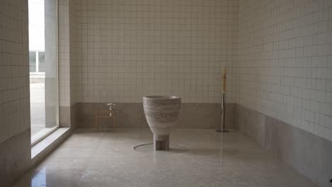 simple, elegant baptismal font in a minimalistic church setting