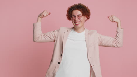 happy man looking confident showing biceps feeling power strength to fight for rights success win