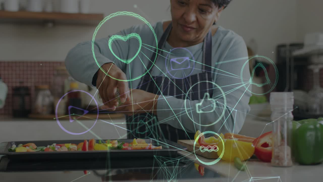 Senior woman grabbing herbs, seasoning bell peppers for roasting with AR icons showing cooking tech