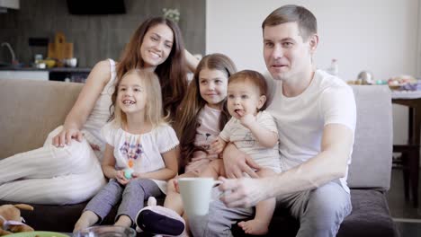 happy family posing in living room