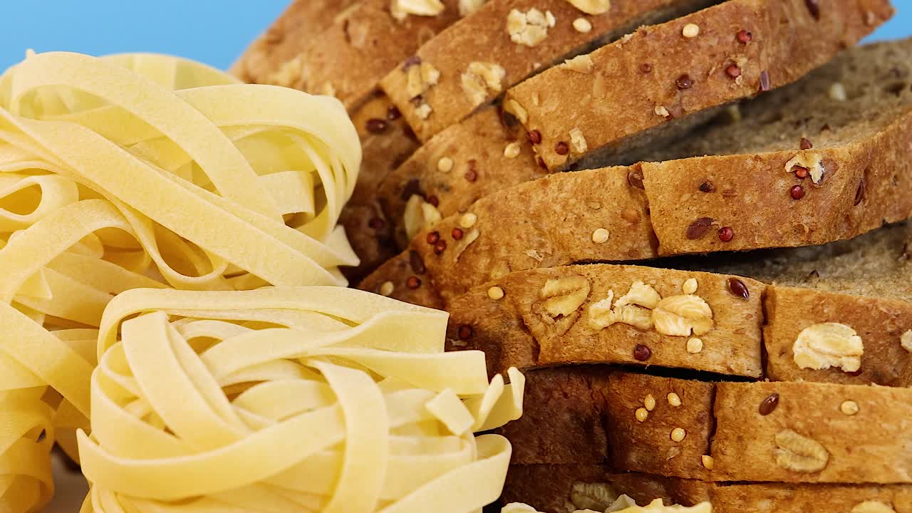 Assortment of grains, bread, and pasta displayed