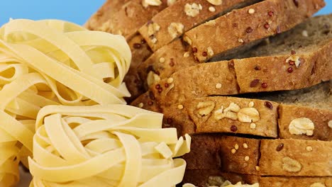 assortment of grains, bread, and pasta displayed
