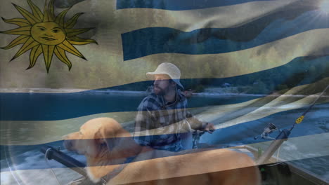 animation of flag of uruguay over caucasian man with dog fishing