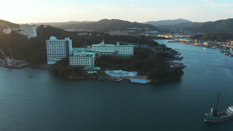 sun rising over toba city and islands of japan in mie prefecture, aerial pan