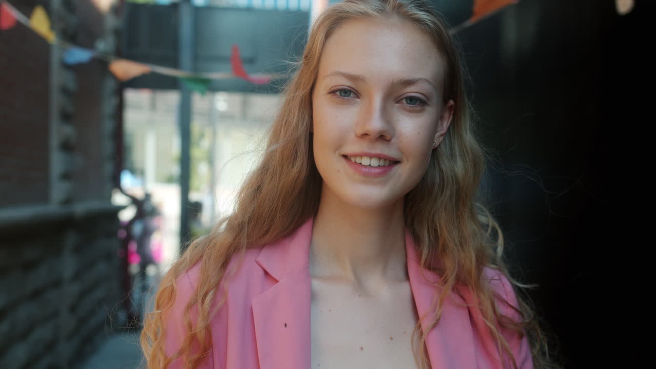 Young Woman Smiling in Urban Setting