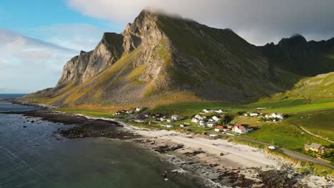 vikten beach, coastline and village at lofoten islands in norway, scandinavia - aerial circling