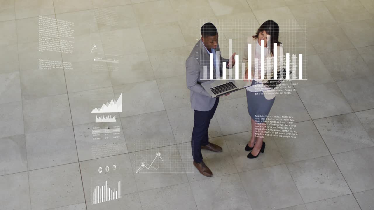 Man holding laptop talking, woman noting clipboard, business charts animating around them planning