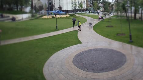 park scene with people on a rainy day