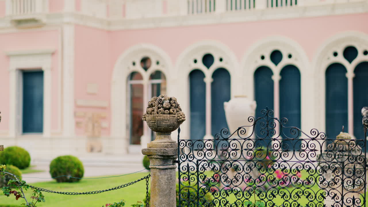 Close up of a decorative stone pillar in the courtyard of Villa Ephrussi de Rothschild with a blurred view on the background