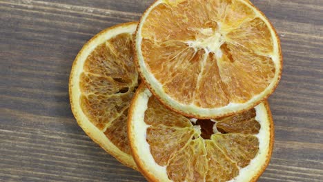 dried orange slices on a wooden background