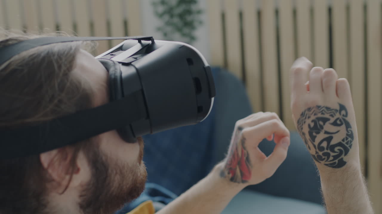 Man Experiencing Virtual Reality with Tribal Tattoo