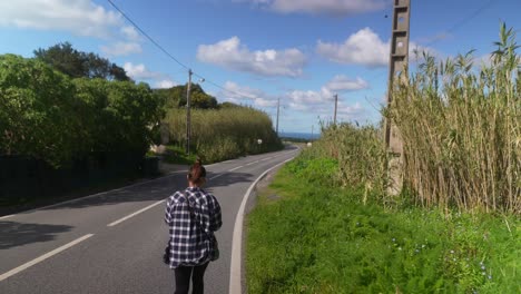 woman walking on a country road