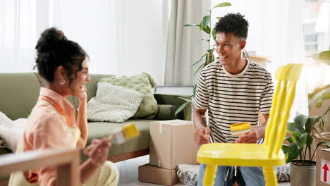 couple painting furniture together