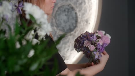 woman arranging a beautiful flower bouquet