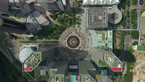 sunny day singapore city famous downtown buildings traffic circle square aerial panorama 4k